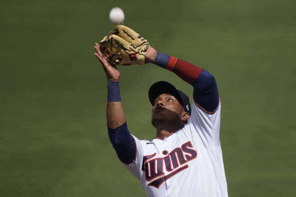 Minnesota Twins shortstop Jorge Polanco catches a fly ball in the second inning during a spring training baseball game against the Boston Red Sox on Sunday, Feb. 28, 2021, in Fort Myers, Fla. (AP Photo/Brynn Anderson)