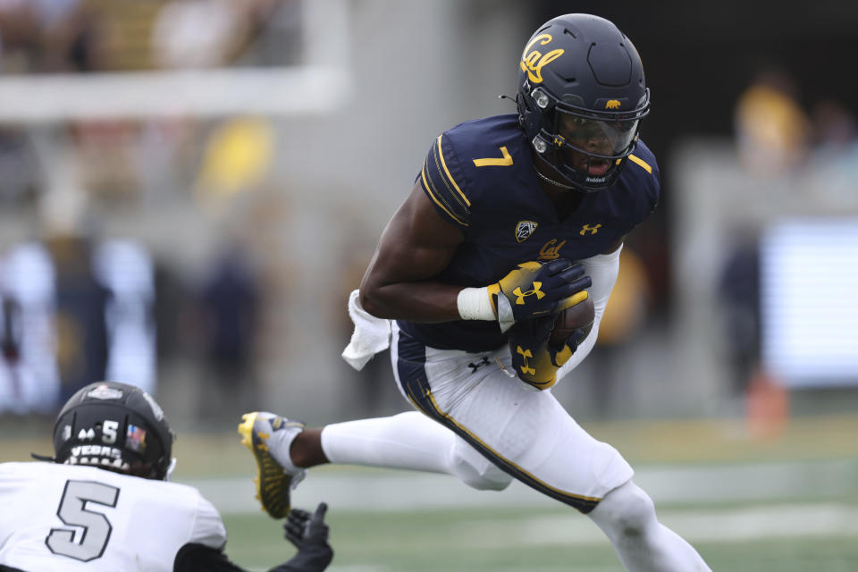 California wide receiver J. Michael Sturdivant (7) runs after a catch against UNLV defensive back Cameron Oliver during the second half of an NCAA college football game in Berkeley, Calif., Saturday, Sept. 10, 2022. (AP Photo/Jed Jacobsohn)