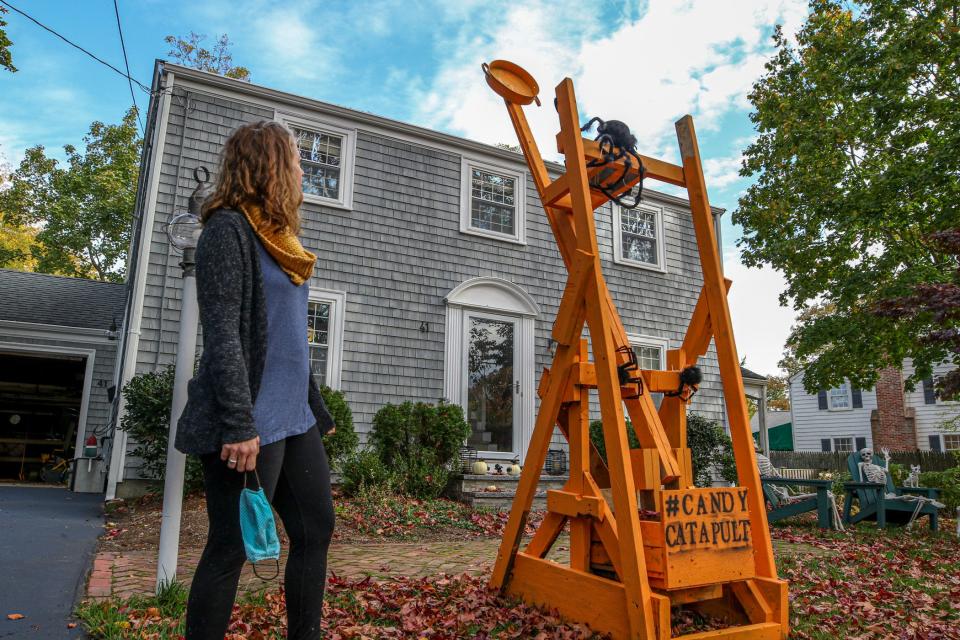 Barrington, Rhode Island mom Lindsey Hingorany takes no credit for the building of this candy catapult that her husband and sons erected for Halloween visitors.