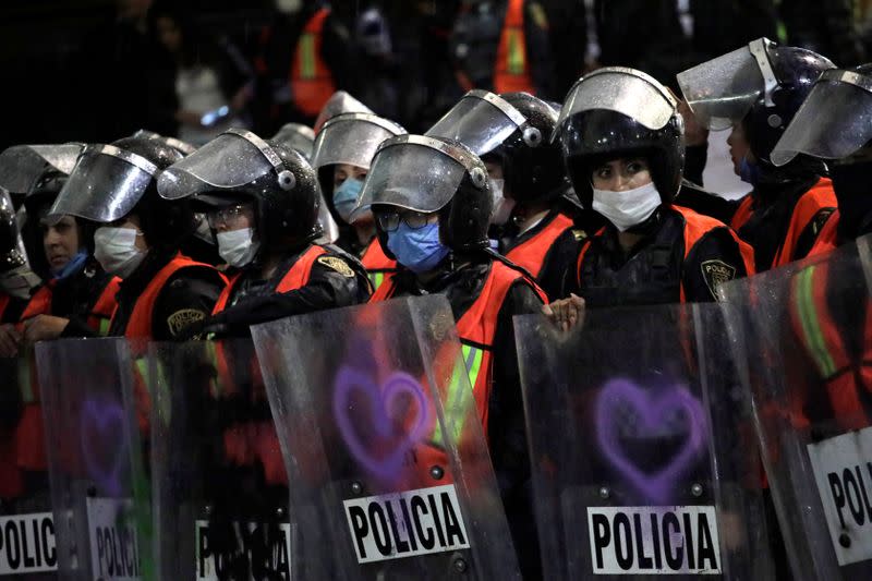 People take part in a protest against gender-based violence in downtown of Mexico City