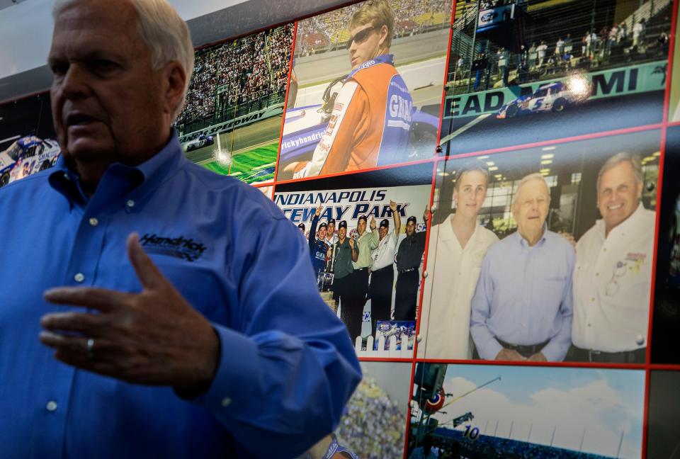 Rick Hendrick pauses to look at the wall of photos that line the trailer from his late son Ricky Hendrick's race team on display inside the 58,000-square-foot Heritage Center in Concord, North Carolina, on July 25, 2023.