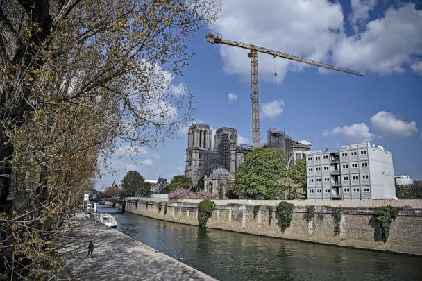 PHOTO: A man walks by the Seine river, near Notre-Dame de Paris cathedral, on April 14, 2021 in Paris. (Anne-christine Poujoulat/AFP via Getty Images, FILE)