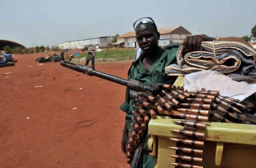 A Sudanese soldier poses next to a machine gun in the oil region of Heglig. Khartoum's warplanes bombed border regions, leading South Sudan's leader on Tuesday to accuse Sudan of declaring war, as the United States condemned the "provocative" strikes