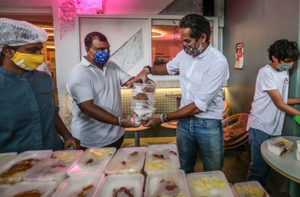 Minister of Science, Technology, and Innovation Khairy Jamaluddin and AirAsia Group CEO Tan Sri Tony Fernandes during the ECM Libra Foundation and Pertiwi Covid-19 Food Aid Programme in Kuala Lumpur August 14, 2020. — Picture by Firdaus Latif