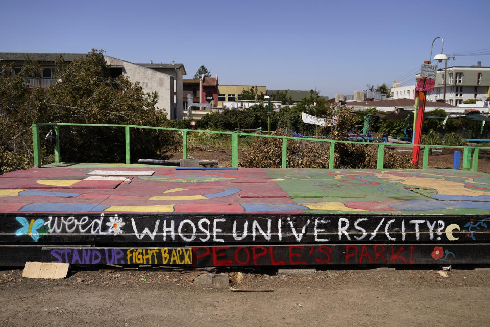 Graffiti covers the People's Stage at People's Park in Berkeley , Calif., Tuesday, Aug. 16, 2022. The three-acre site's colorful history, forged from University of California, Berkeley's seizure of the land in 1968, has been thrust back into the spotlight by the school's renewed effort to pave over People's Park as part of a $312 million project that includes sorely needed housing for about 1,000 students. (AP Photo/Eric Risberg)