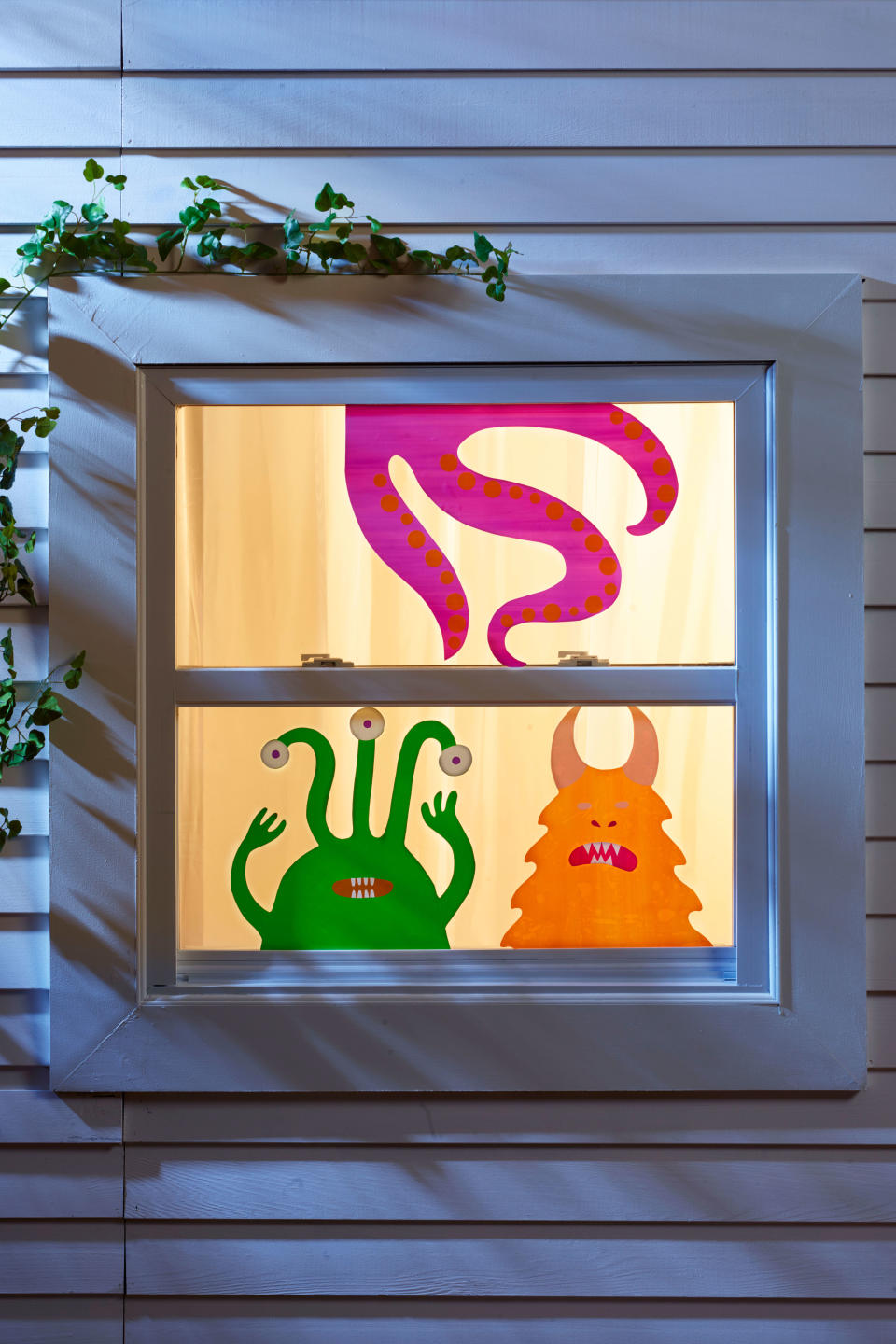 <p>These adorable window monsters will spook (and delight!) passersby.</p><p><a rel="nofollow noopener" href="http://wdy.h-cdn.co/assets/downloads/1504898509_-_monsters-template.pdf" target="_blank" data-ylk="slk:Get the monsters template.;elm:context_link;itc:0;sec:content-canvas" class="link ">Get the monsters template.</a></p>