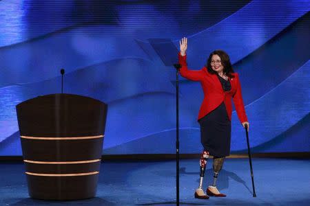 U.S. congressional candidate Tammy Duckworth (D-IL), former Assistant Secretary of the U.S. Department of Veterans Affairs, who lost both of her legs to injuries sustained while serving as a U.S. Army helicopter pilot in combat in Iraq, waves as she departs after addressing delegates during the first day of the Democratic National Convention in Charlotte, North Carolina, in this September 4, 2012, file photo. REUTERS/Jason Reed/Files