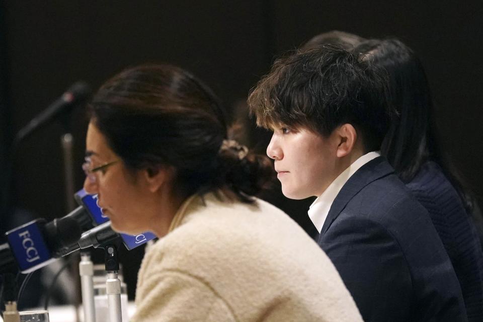 Rina Gonoi, former member of the Japan Ground Self-Defense Forces, right attends the press conference at the Foreign Correspondents' Club of Japan, Wednesday, Dec. 13, 2023, in Tokyo. A Japanese court on Tuesday convicted three former soldiers in a sexual assault case that authorities had dropped until Gonoi came forward demanding a reinvestigation and prompting a military-wide harassment probe. (AP Photo/Eugene Hoshiko)