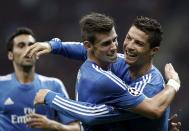 Real Madrid's Cristiano Ronaldo (R) celebrates a goal with team mate Gareth Bale (C) against Galatasaray during their Champions League Group B soccer match at Turk Telekom Arena in Istanbul September 17, 2013. REUTERS/Osman Orsal (TURKEY - Tags: SPORT SOCCER)