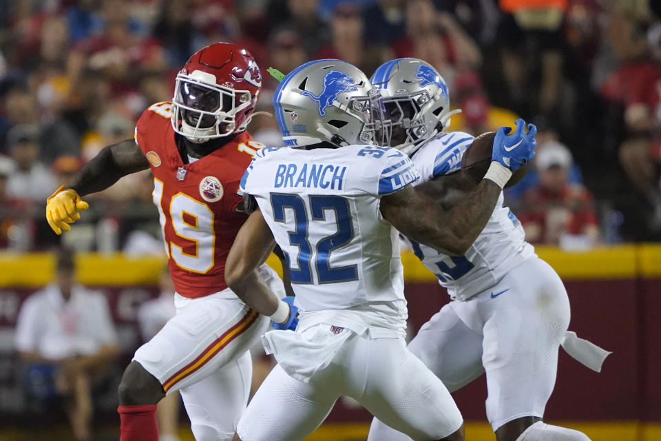 Detroit Lions safety Brian Branch (32) intercepts a pass intended for Kansas City Chiefs wide receiver Kadarius Toney (19) before running it back for a touchdown during the second half of an NFL football game Thursday, Sept. 7, 2023, in Kansas City, Mo. (AP Photo/Ed Zurga)