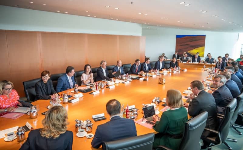 German Chancellor Olaf Scholz (C) presides over the Federal Cabinet in the German Chancellery.  Michael Kappeler/dpa