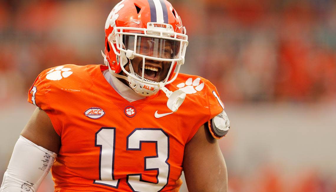 Clemson defensive tackle Tyler Davis (13) celebrates after watching Clemson linebacker Jeremiah Trotter Jr. sack Miami during first-quarter action in Clemson, S.C. on Saturday, Nov. 19, 2022. (Travis Bell/SIDELINE CAROLINA)