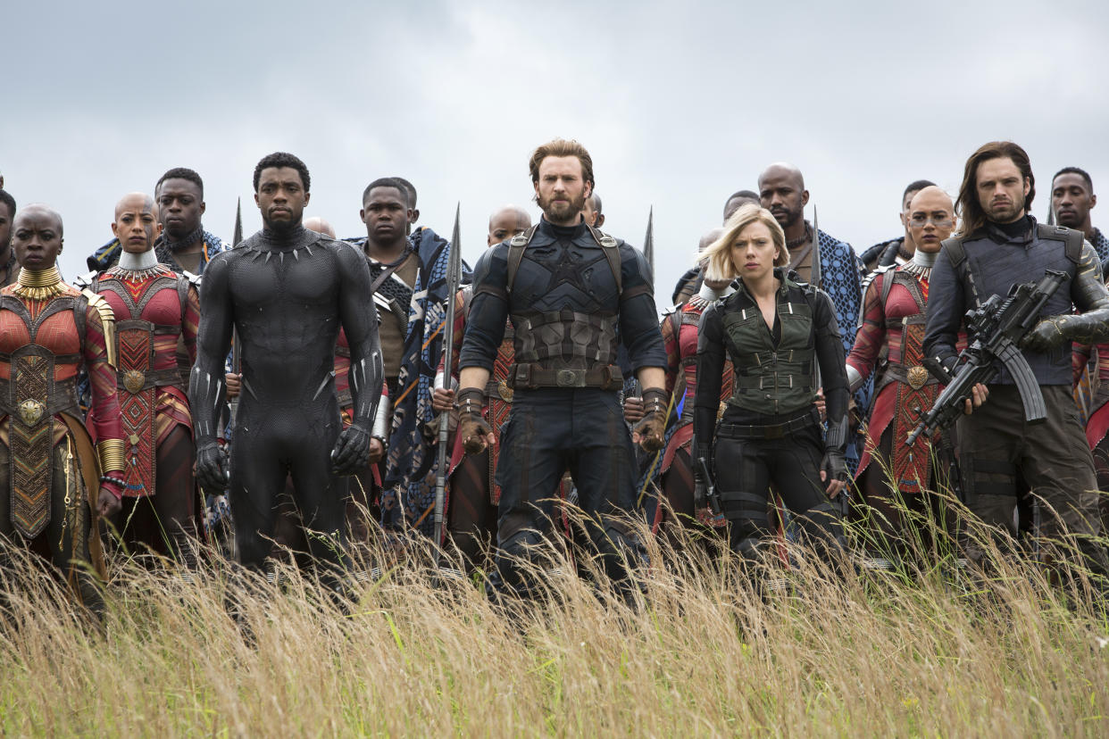 This image released by Marvel Studios shows, front row from left, Danai Gurira, Chadwick Boseman, Chris Evans, Scarlet Johansson and Sebastian Stan in a scene from “Avengers: Infinity War”. (Chuck Zlotnick/Marvel Studios via AP)