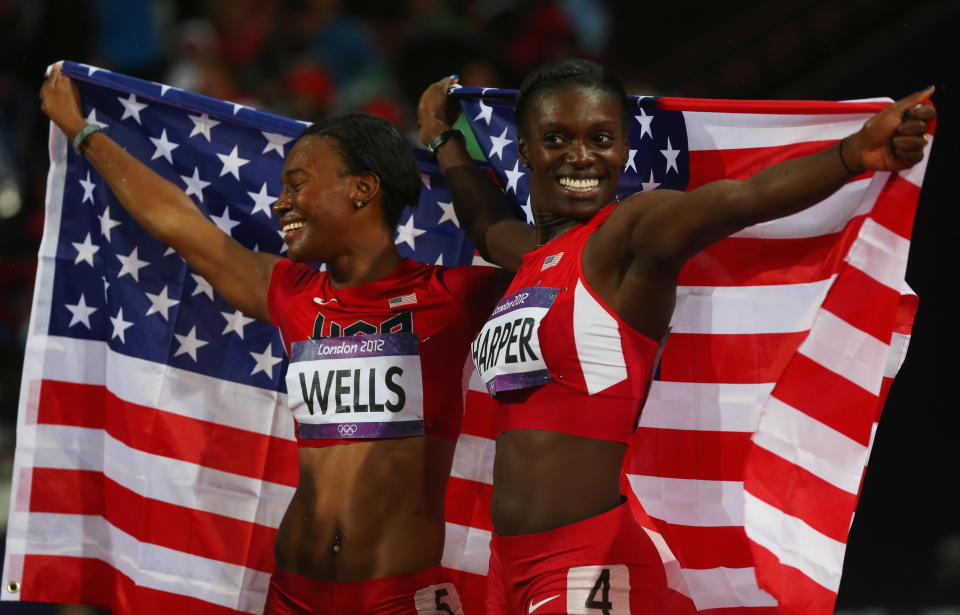 LONDON, ENGLAND - AUGUST 07: Bronze medalist Kellie Wells and silver medalist Dawn Harper of the United States celebrate after the Women's 100m Hurdles Final on Day 11 of the London 2012 Olympic Games at Olympic Stadium on August 7, 2012 in London, England. (Photo by Alexander Hassenstein/Getty Images)