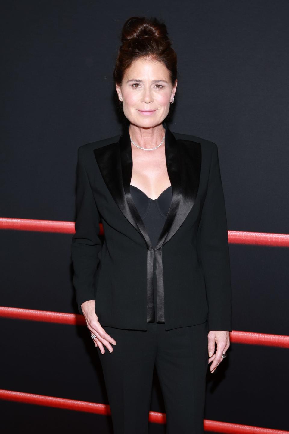 Maura Tierney in a black suit at "The Iron Claw" premiere