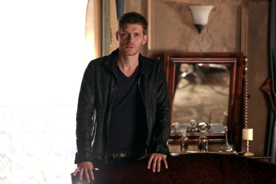 Joseph as Klaus in front of a vanity mirror