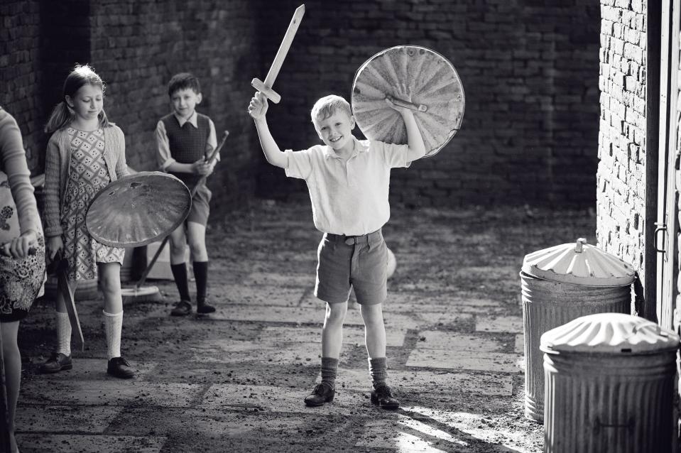 Jude Hill holds a trash can lid shield an sword