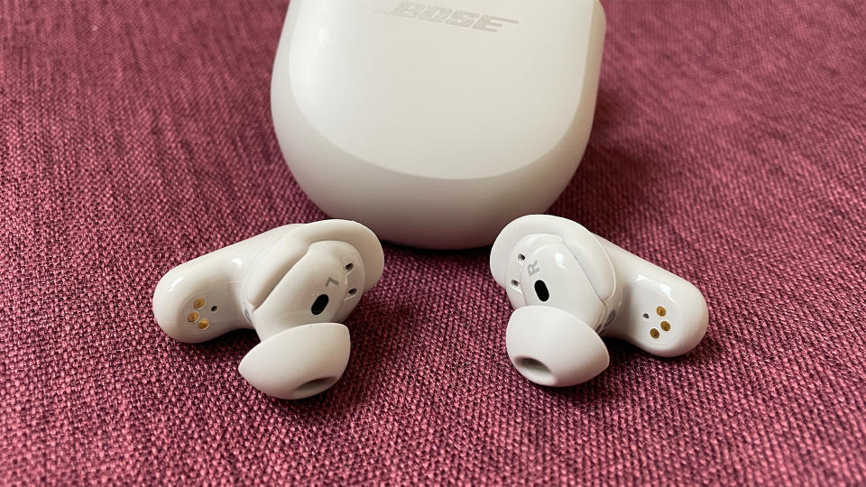 Bose QuietComfort Ultra Earbuds on a purple background