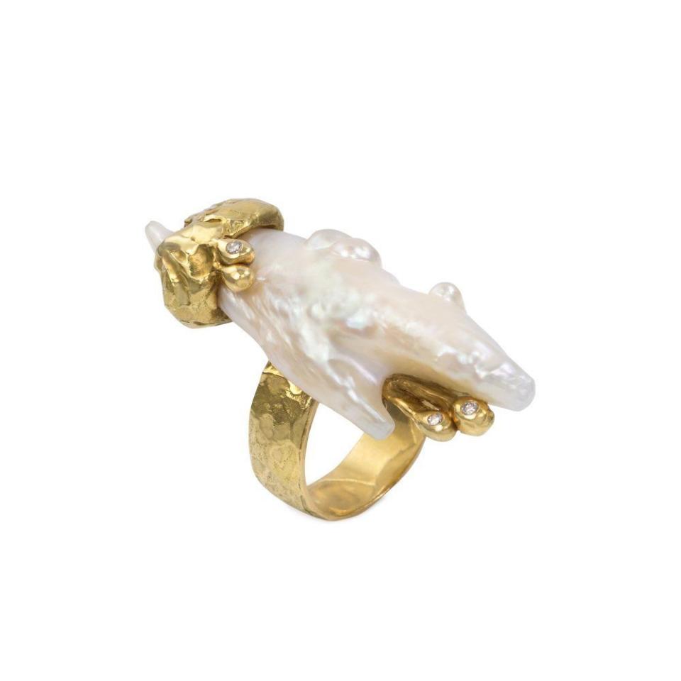 <p>mahnazcollection.com</p><p><a href="https://mahnazcollection.com/design-art/baroque-pearl-diamond-and-gold-ring-paolo-spalla" rel="nofollow noopener" target="_blank" data-ylk="slk:Shop Now;elm:context_link;itc:0;sec:content-canvas" class="link ">Shop Now</a></p><p>A modern take on the cocktail ring, this organic shape is dynamic and statement-making. </p>