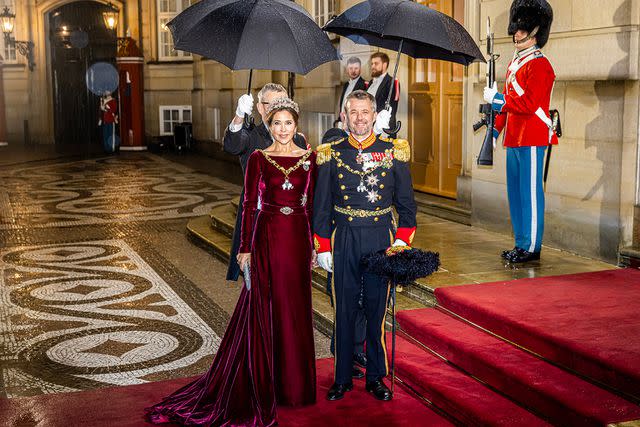 <p>Patrick van Katwijk/Getty Images</p> Queen Mary, wearing her go-to dress for the event, and King Frederik of Denmark at the new year reception on January 1, 2024