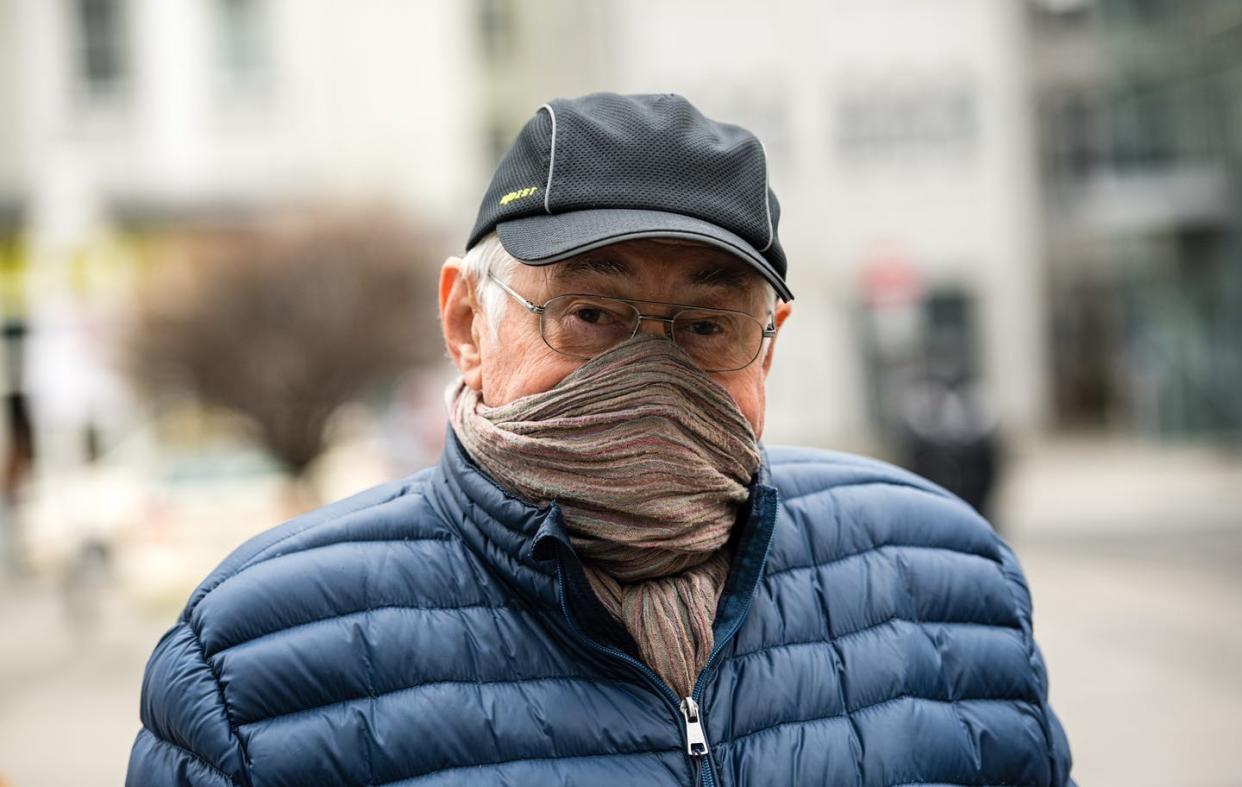 <span class="caption">People have resorted to using scarves and bandanas as face masks to protect against spreading coronavirus. While cloth masks aren't as effective as surgical masks, research suggests they can limit the spread of droplets.</span> <span class="attribution"><a class="link " href="http://gettyimages.com" rel="nofollow noopener" target="_blank" data-ylk="slk:Jens Schleuter/Getty Images;elm:context_link;itc:0;sec:content-canvas">Jens Schleuter/Getty Images</a></span>