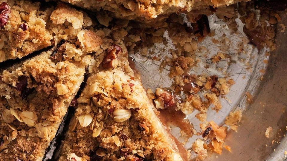 pear crumb pie in a metal pie tin and cut into slices