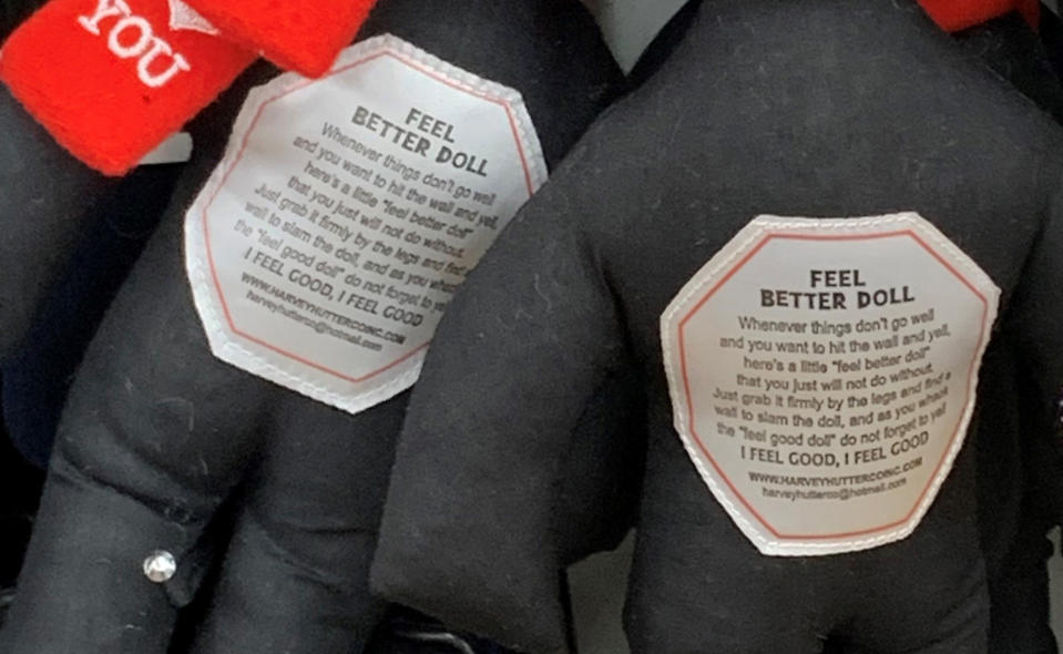 This undated photo provided by New Jersey state Assemblywoman Angela McKnight shows "Feel Better Dolls" on the shelf of a One Dollar Zone store in Bayonne, N.J. The black rag dolls that came with instructions to "find a wall" and slam the toy against it have been pulled from three stores after customers and the lawmaker said they were offensive. (Angela McKnight via AP)