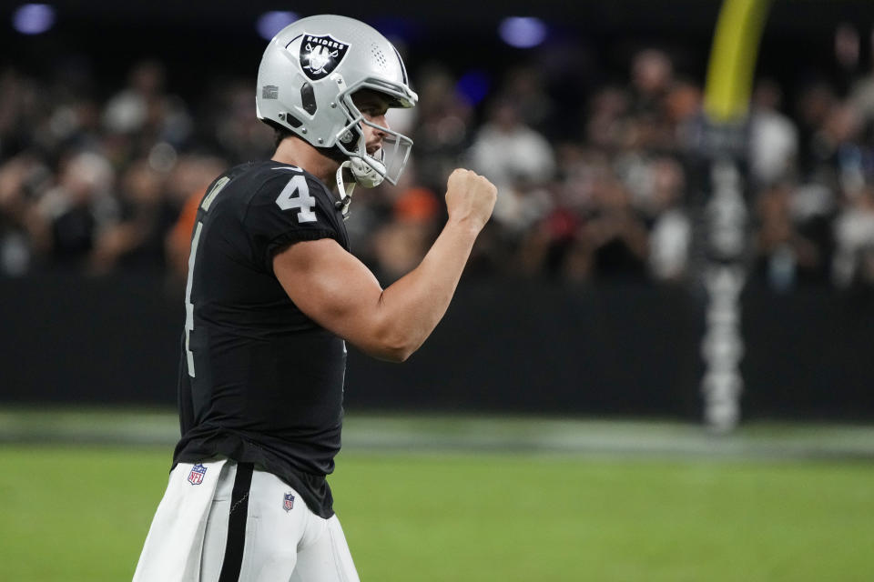 Las Vegas Raiders quarterback Derek Carr (4) celebrates after his team scored a touchdown against the Baltimore Ravens during the second half of an NFL football game, Monday, Sept. 13, 2021, in Las Vegas. (AP Photo/Rick Scuteri)