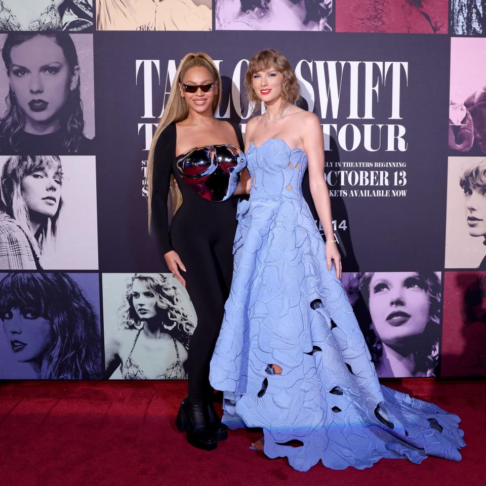 Beyoncé and Taylor Swift pose together at the Eras Tour concert movie premiere on October 11, 2023.