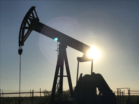 FILE PHOTO: A pump jack is seen at sunset near Midland, Texas, U.S., on May 3, 2017. REUTERS/Ernest Scheyder