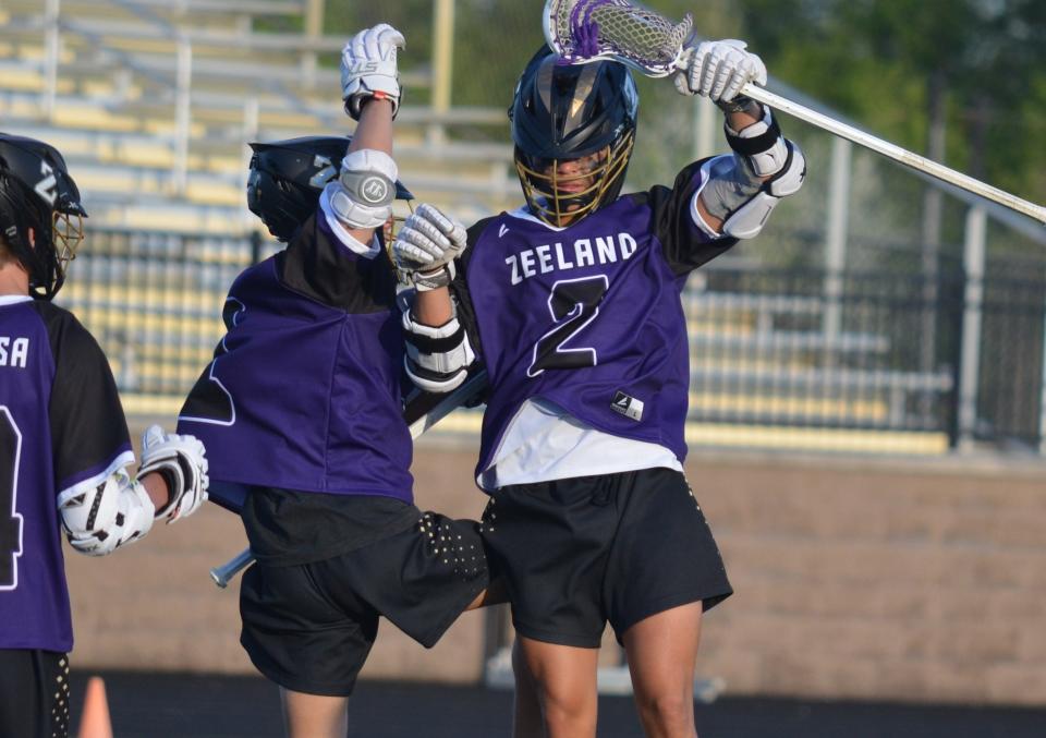 Zeeland's Niko Moungkhoun, right, celebrates with a teammate after a goal against West Ottawa on Wednesday, May 1, 2024, at Zeeland Stadium.
