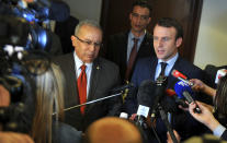 French Presidential candidate Emmanuel Macron, right, answers reporters with Algerian Foreign Minister Ramtane Lamamra in Algiers, Monday Feb. 13, 2017. Claims made by Macron's campaign chairman Richard Ferrand Monday, assert that Russian groups are interfering with his presidential campaign but have offered little evidence to back up the claim. (AP Photo/Anis Belghoul)