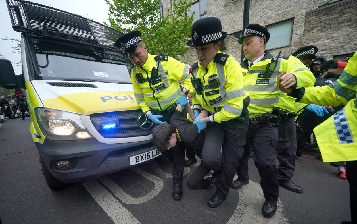 Officers remove one protester