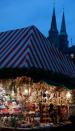 NUREMBERG, GERMANY - NOVEMBER 30: Christmas decorations hang for sale at a stand at the traditional Christmas market 'Nuernberger Christkindlesmarkt' ahead of the opening ceremony on November 30, 2012 in Nuremberg, Germany. Originated in the 16th century the Nuremberg Christmas market is seen as one of the oldest of its kind in Germany. (Photo by Johannes Simon/Getty Images)