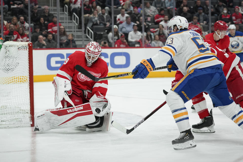 Detroit Red Wings goaltender Alex Nedeljkovic (39) stops a Buffalo Sabres left wing Jeff Skinner (53) shot in the third period of an NHL hockey game Saturday, Jan. 15, 2022, in Detroit. (AP Photo/Paul Sancya)