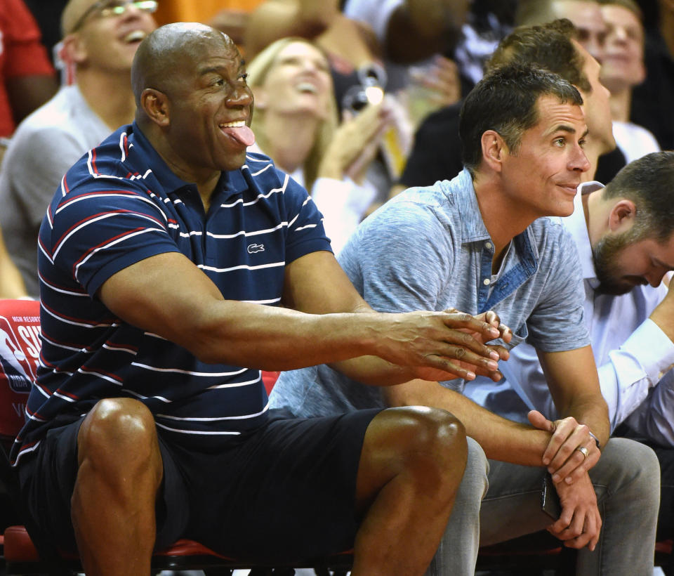 Los Angeles Lakers president of basketball operations Magic Johnson and general manager Rob Pelinka watch a game at the NBA’s 2017 Las Vegas Summer League. (Getty Images)