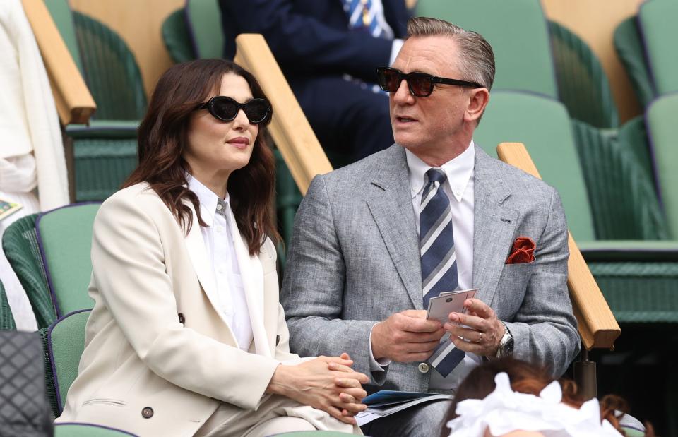 Rachel Weisz, left, and Daniel Craig twinned in sharp jackets and dark shades.