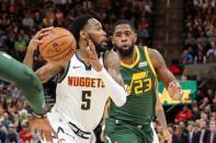 Jan 23, 2019; Salt Lake City, UT, USA; Denver Nuggets guard Will Barton (5) tries to get past Utah Jazz forward Royce O'Neale (23) and to the basket during the second quarter at Vivint Smart Home Arena. Mandatory Credit: Chris Nicoll-USA TODAY Sports