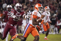 Clemson running back Kobe Pace (20) runs for a touchdown as South Carolina defensive back David Spaulding (29) trails during the first half of an NCAA college football game Saturday, Nov. 27, 2021, in Columbia, S.C. (AP Photo/Sean Rayford)