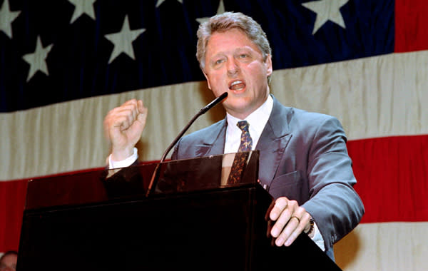 Democratic Presidential candidate Bill Clinton pumps his fist during his celebration party on April 7, 1992 in New York. (Don Emmert/AFP via Getty Images)