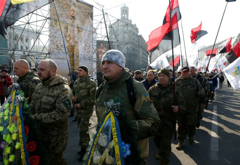 Ukrainians mark the third anniversary of the deaths of anti-government protesters in Kiev in February 2014