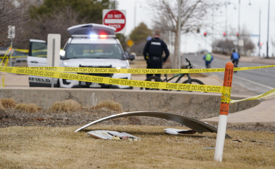 A piece of commercial airplane debris is surrounded by police tape where it landed along Midway Boulevard in Broomfield, Colo., as the plane shed parts while making an emergency landing at nearby Denver International Airport Saturday, Feb. 20, 2021. (AP Photo/David Zalubowski)