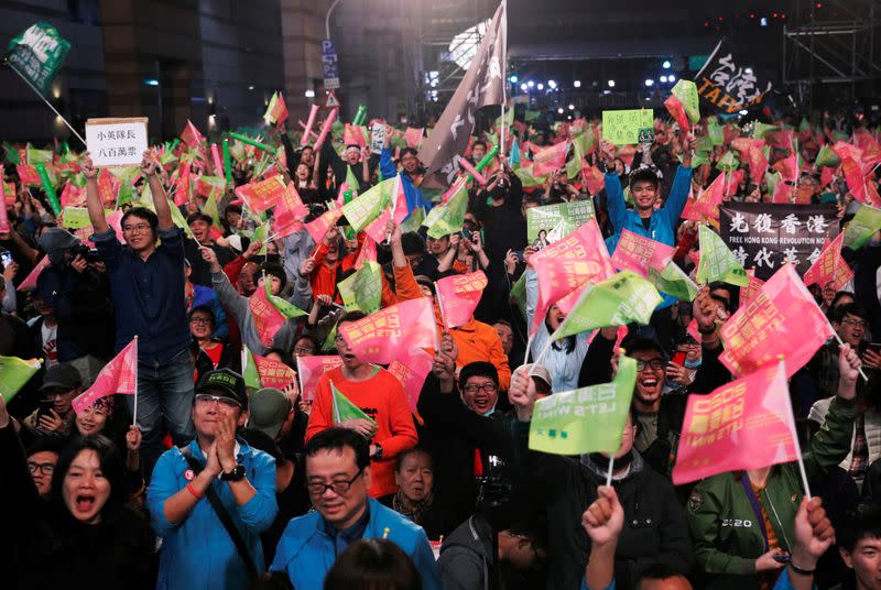 Supporters of Taiwan President Tsai Ing-wen celebrate the preliminary results at a rally outside the Democratic Progressive Party (DPP) headquarters in Taipei
