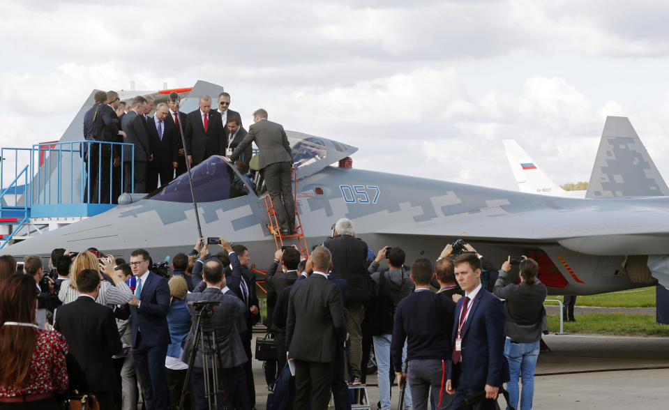 Russian President Vladimir Putin and Turkish President Recep Tayyip Erdogan inspect Sukhoi Su-57 fifth-generation fighter during the MAKS-2019 International Aviation and Space Show in Zhukovsky, outside Moscow, Russia, Tuesday, Aug. 27, 2019. Turkish President is on a short working visit in Russia. (Maxim Shipenkov/Pool Photo via AP)