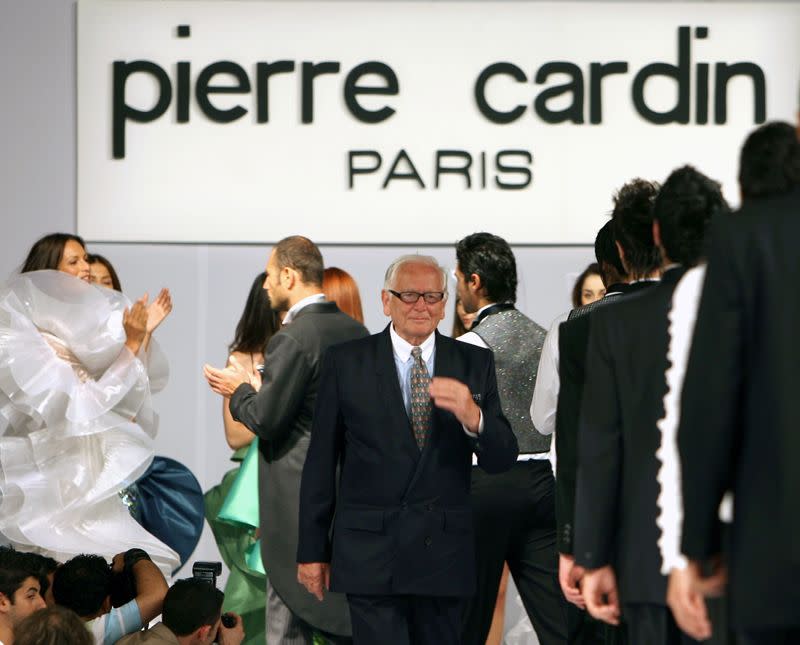 FILE PHOTO: French fashion designer Cardin receives applause by models following fashion show at Ciragan Palace in Istanbul