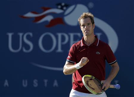 Richard Gasquet of France celebrates a point against David Ferrer of Spain at the U.S. Open tennis championships in New York September 4, 2013. REUTERS/Eduardo Munoz