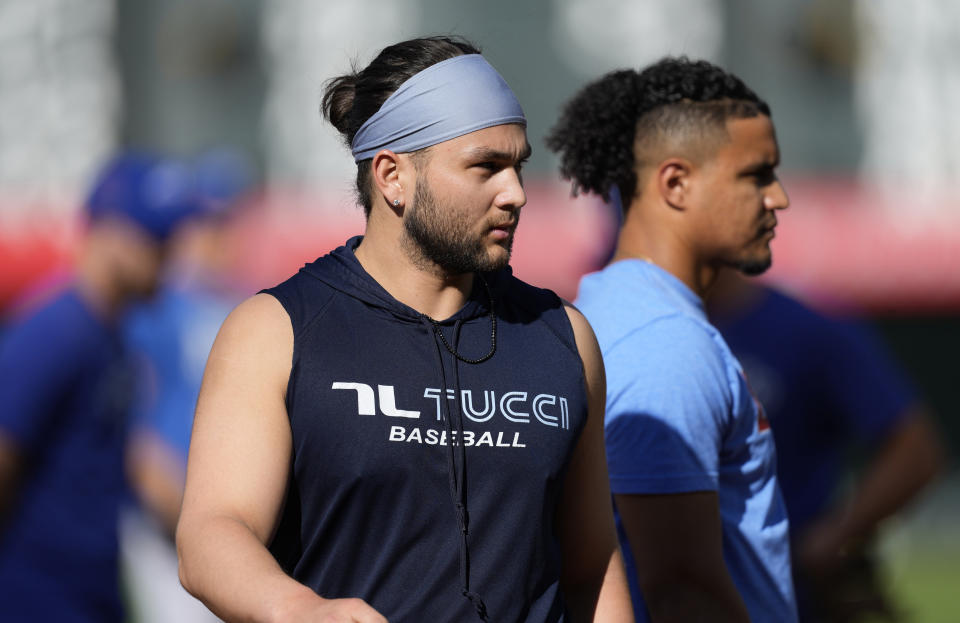 Toronto Blue Jays infielder Bo Bichette warms up for the team's baseball game against the Colorado Rockies on Friday, Sept. 1, 2023, in Denver. (AP Photo/David Zalubowski)