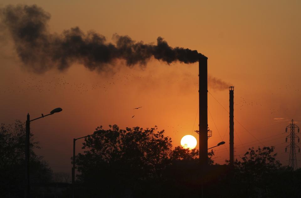 A factory in Ahmadabad, India, emitting smoke