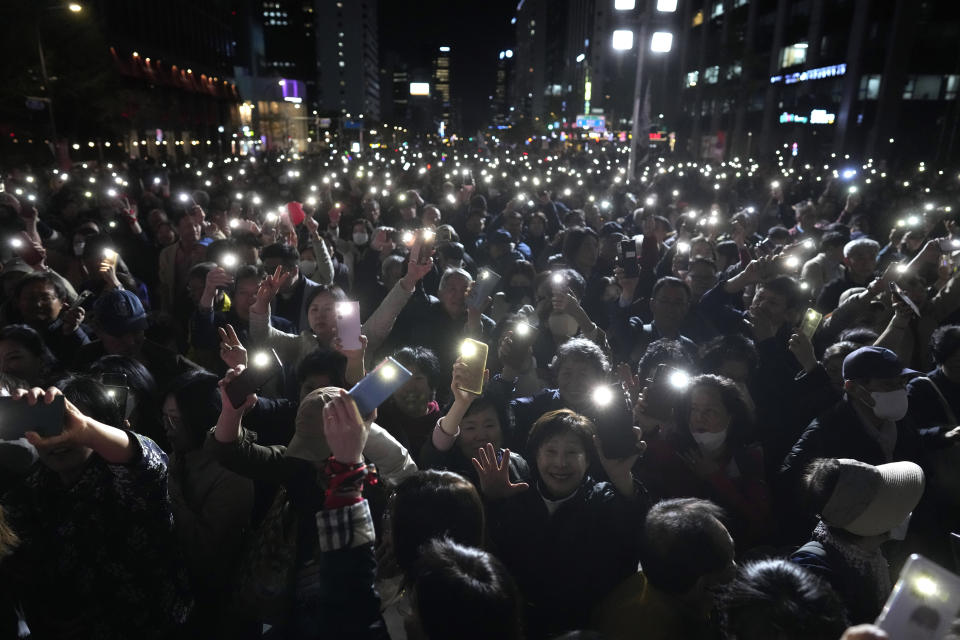 FILE - Supporters of South Korea's ruling People Power Party flash their smartphones' lights during the party's parliamentary election campaign in Seoul, South Korea, Tuesday, April 9, 2024. South Korean voters have handed liberals extended opposition control of parliament in what looks like a massive political setback to conservative President Yoon Suk Yeol. Some experts say the results of Wednesday’s parliamentary elections make Yoon “a lame duck” — or even “a dead duck” — for his remaining three years in office. Others disagree, saying Yoon still has many policy levers and could aggressively push his foreign policy agenda. (AP Photo/Lee Jin-man, File)