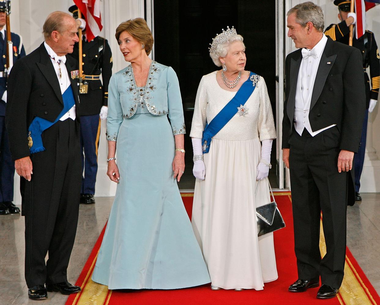 President George W. Bush and first lady Laura Bush stand with Queen Elizabeth and Prince Philip at a 2007 state dinner.